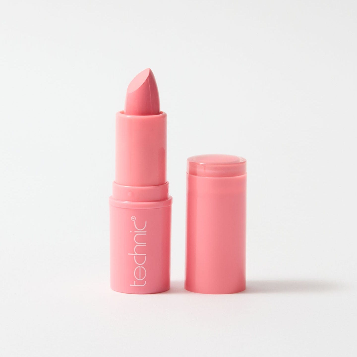 An open lipstick in the shade Bare All on a white background.