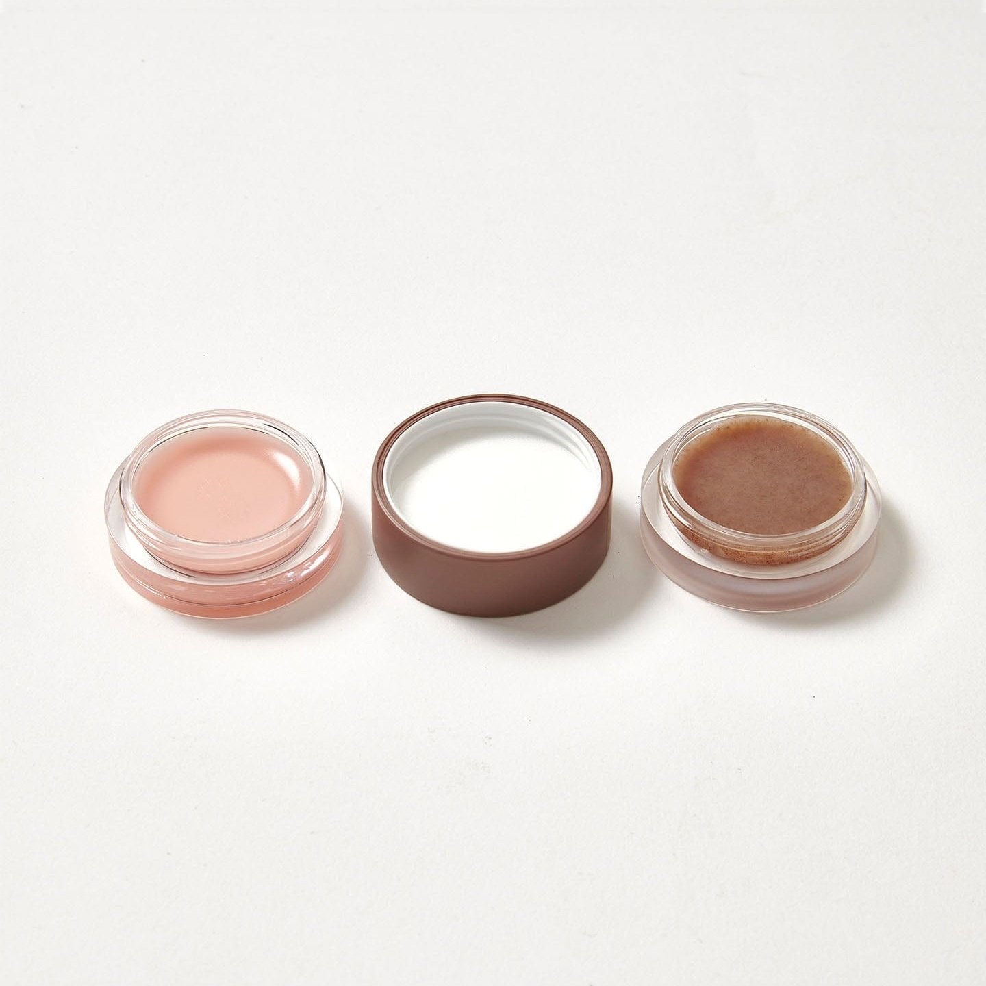 A lip balm and scrub duo in the flavour Strawberry Sundae open on both sides.