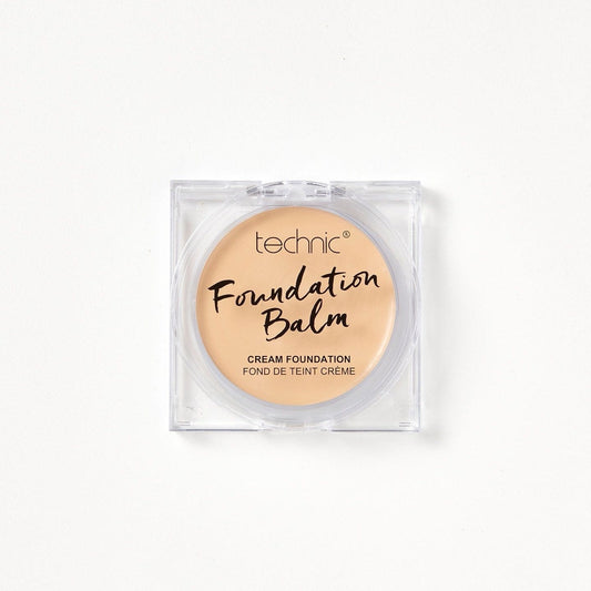 A foundation balm in the shade Oat Milk on a white background. 