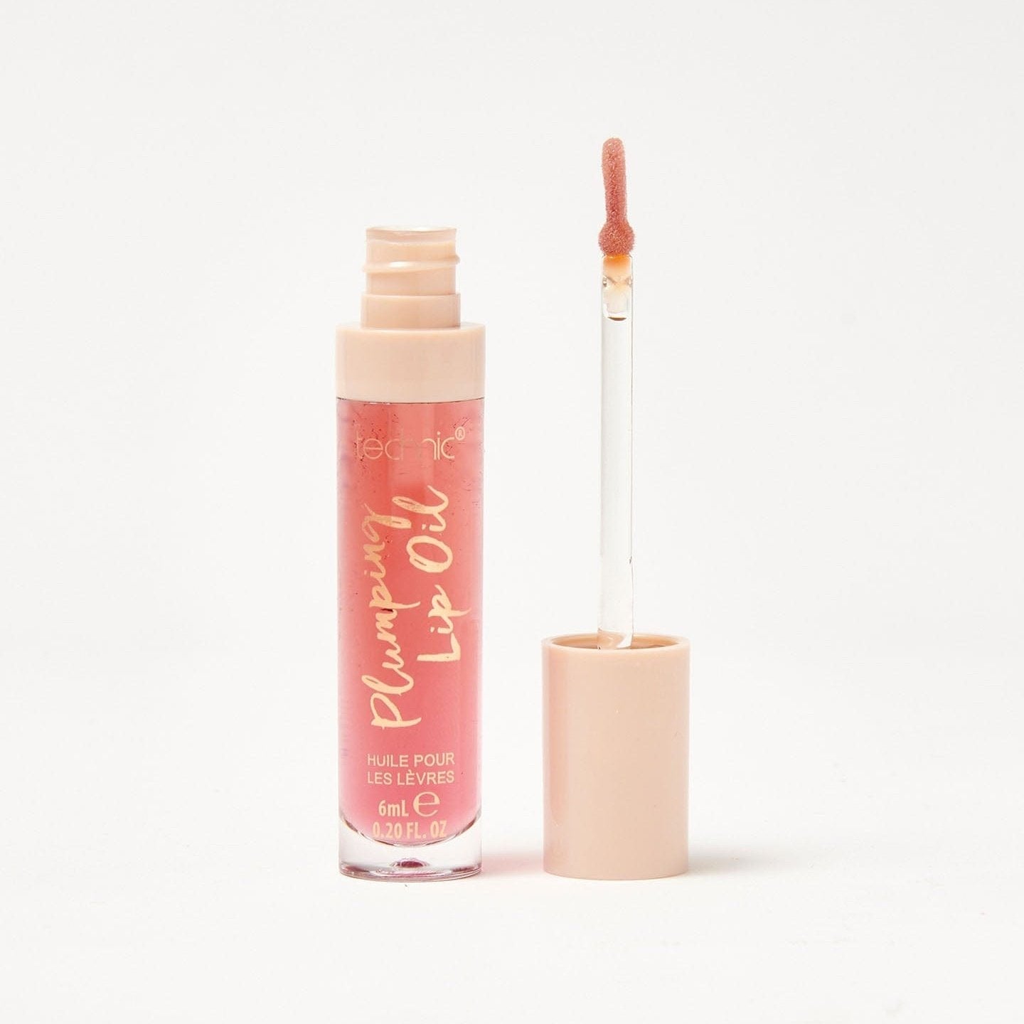 An opened plumping lip oil in the shade Chocolate Bombe on a white background.