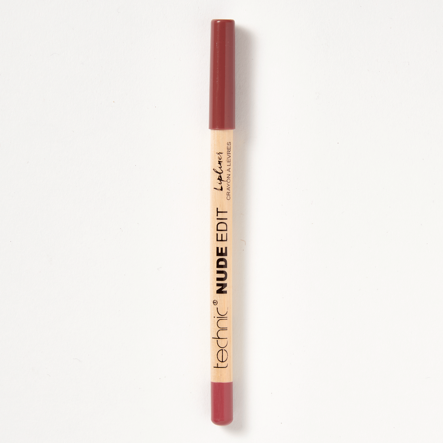 A nude edit lip liner in the shade Bare on a white background. 