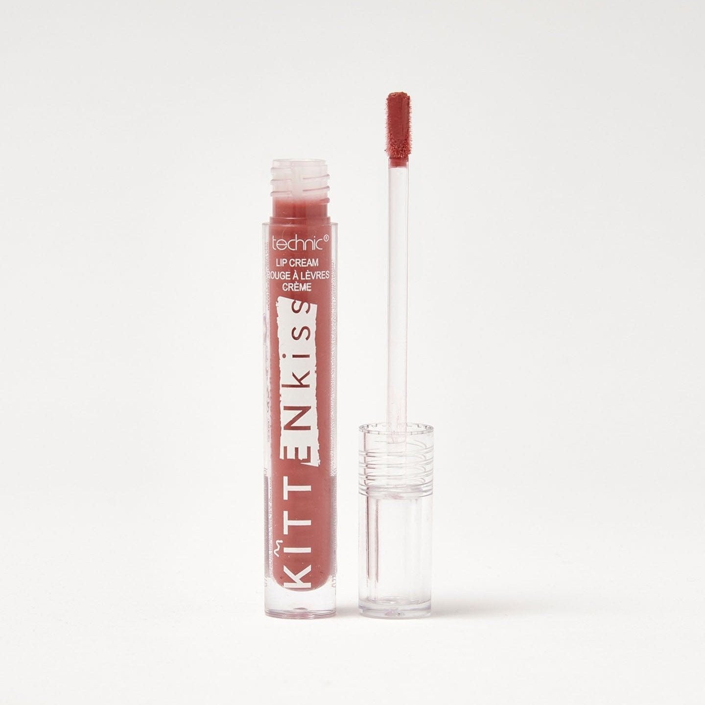 An opened kitten kiss lip cream in the shade Twice Shy on a white background.