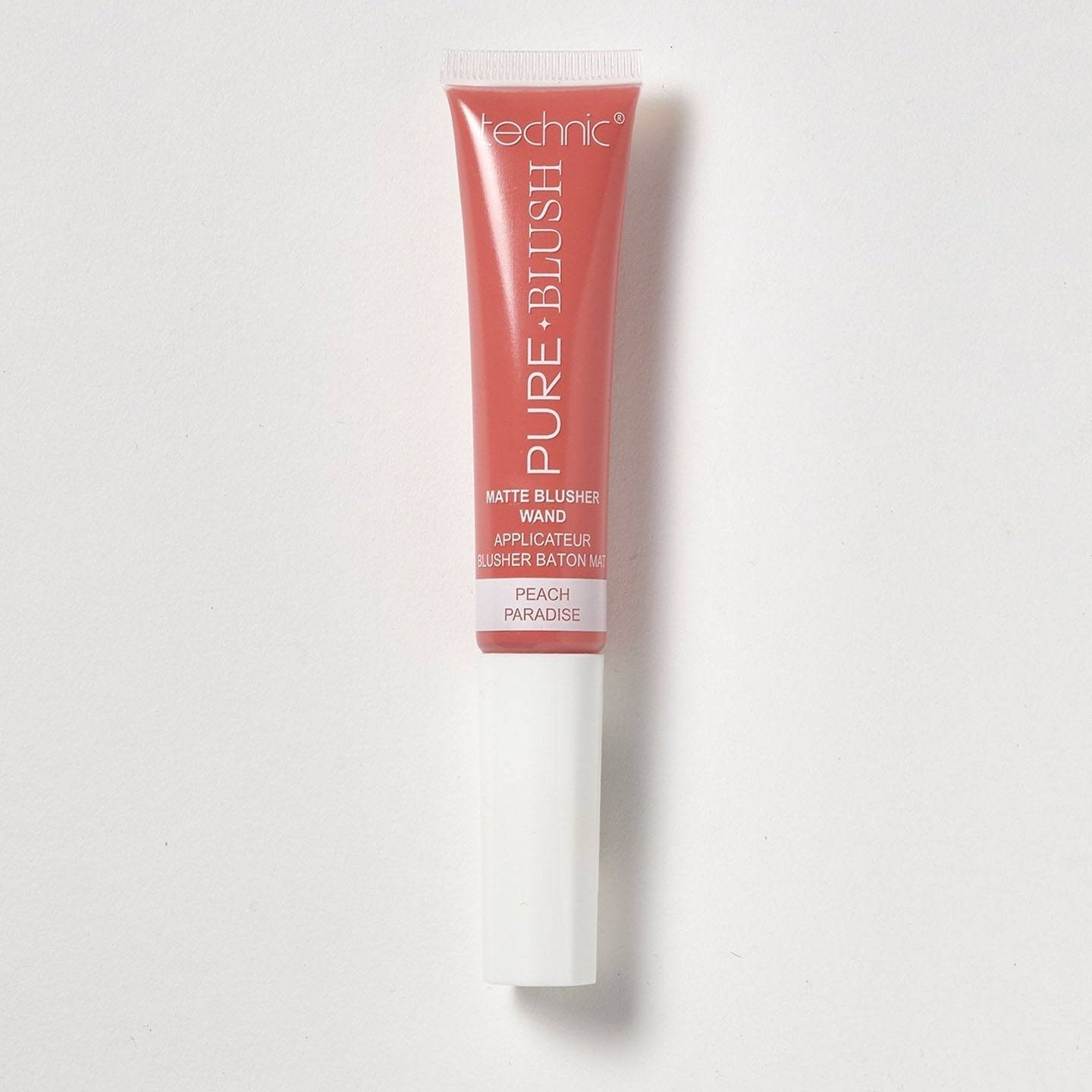 A blusher wand in the shade Peach Paradise on a white background. 