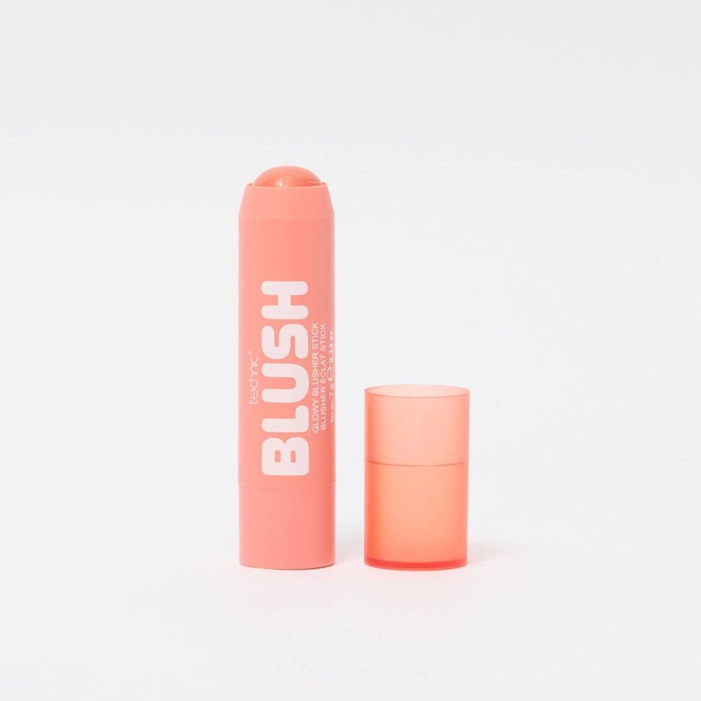 An opened blusher stick in the shade Peach Syrup on a white background.