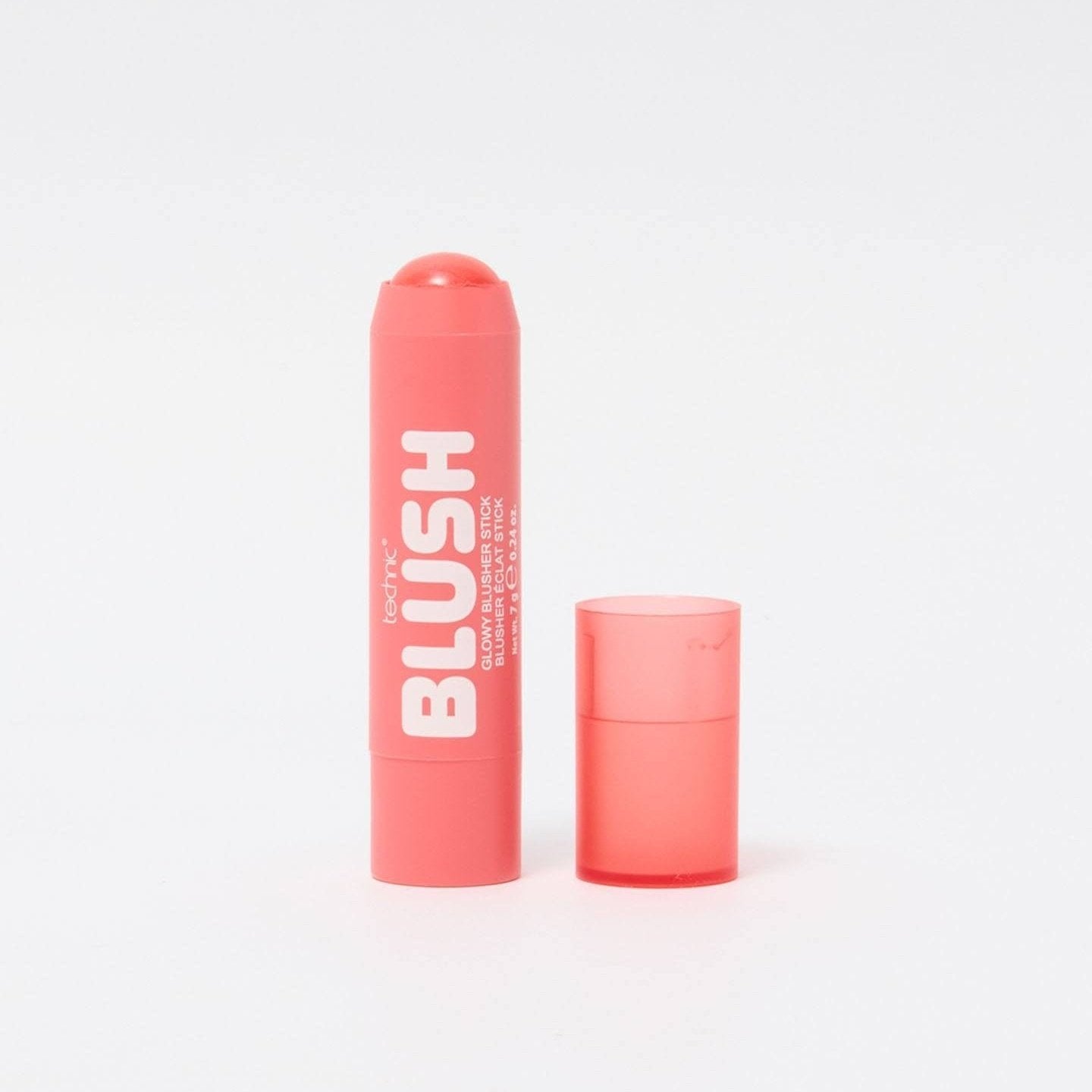 An opened blusher stick in the shade Tropic Heart on a white background.