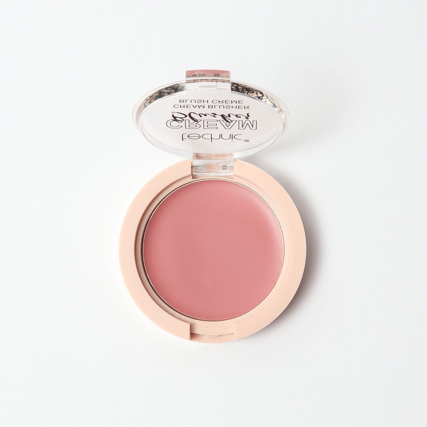 An opened cream blusher in the shade Swoon on a white background.