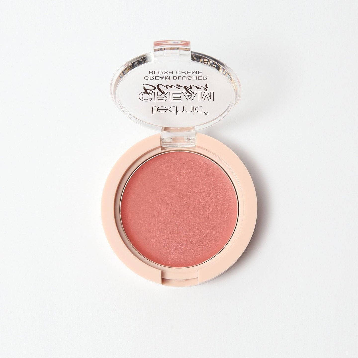 An opened cream blusher in the shade Flushed on a white background.