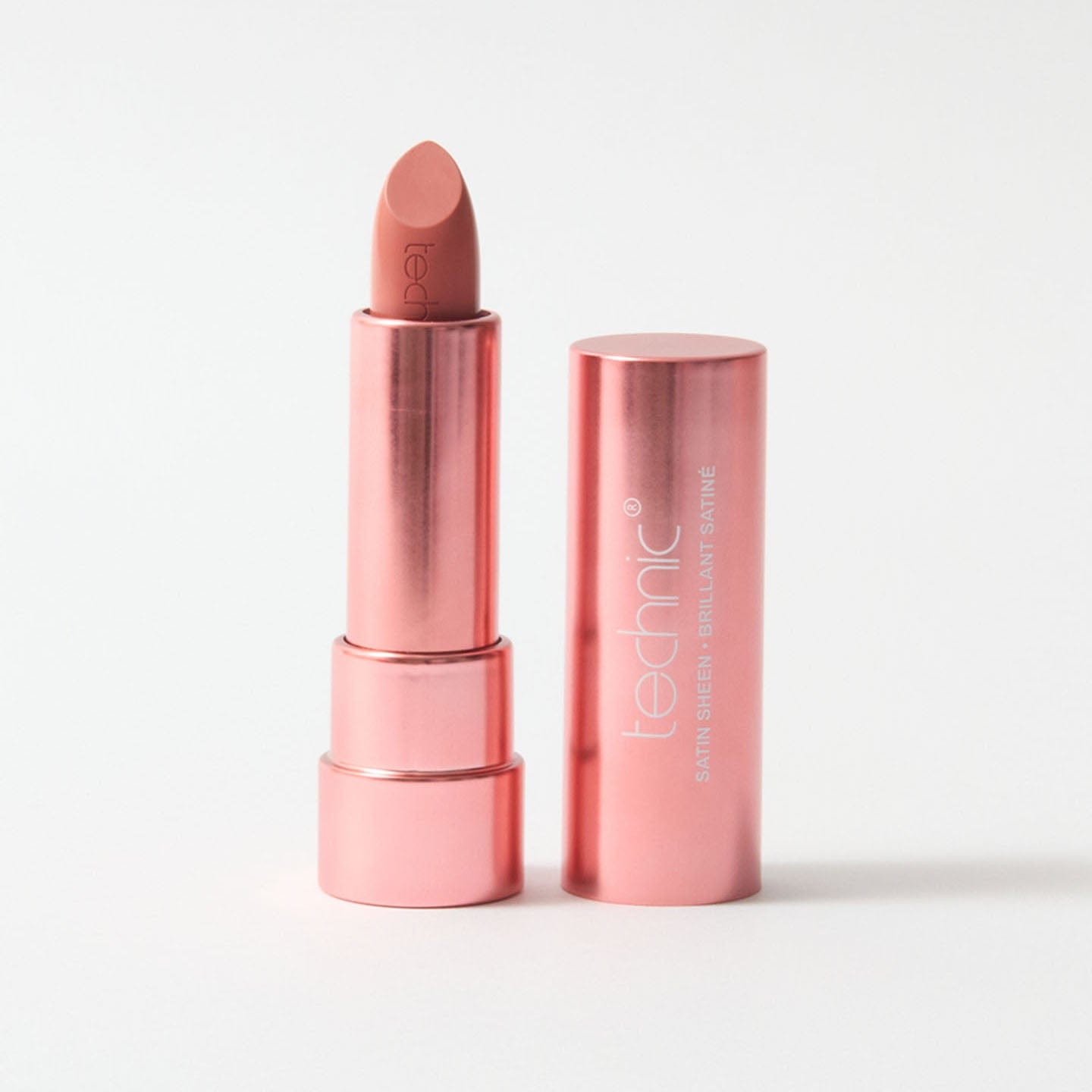 An opened lipstick in the shade Beguiling on a white background.