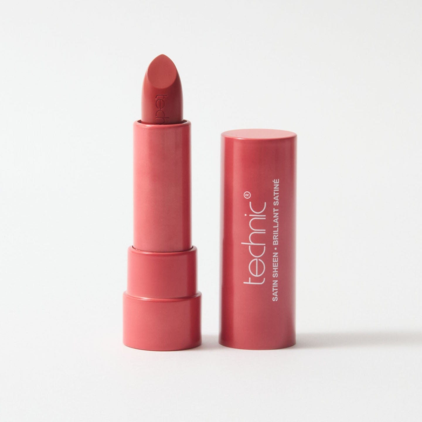 An opened lipstick in the shade Fearless on a white background.