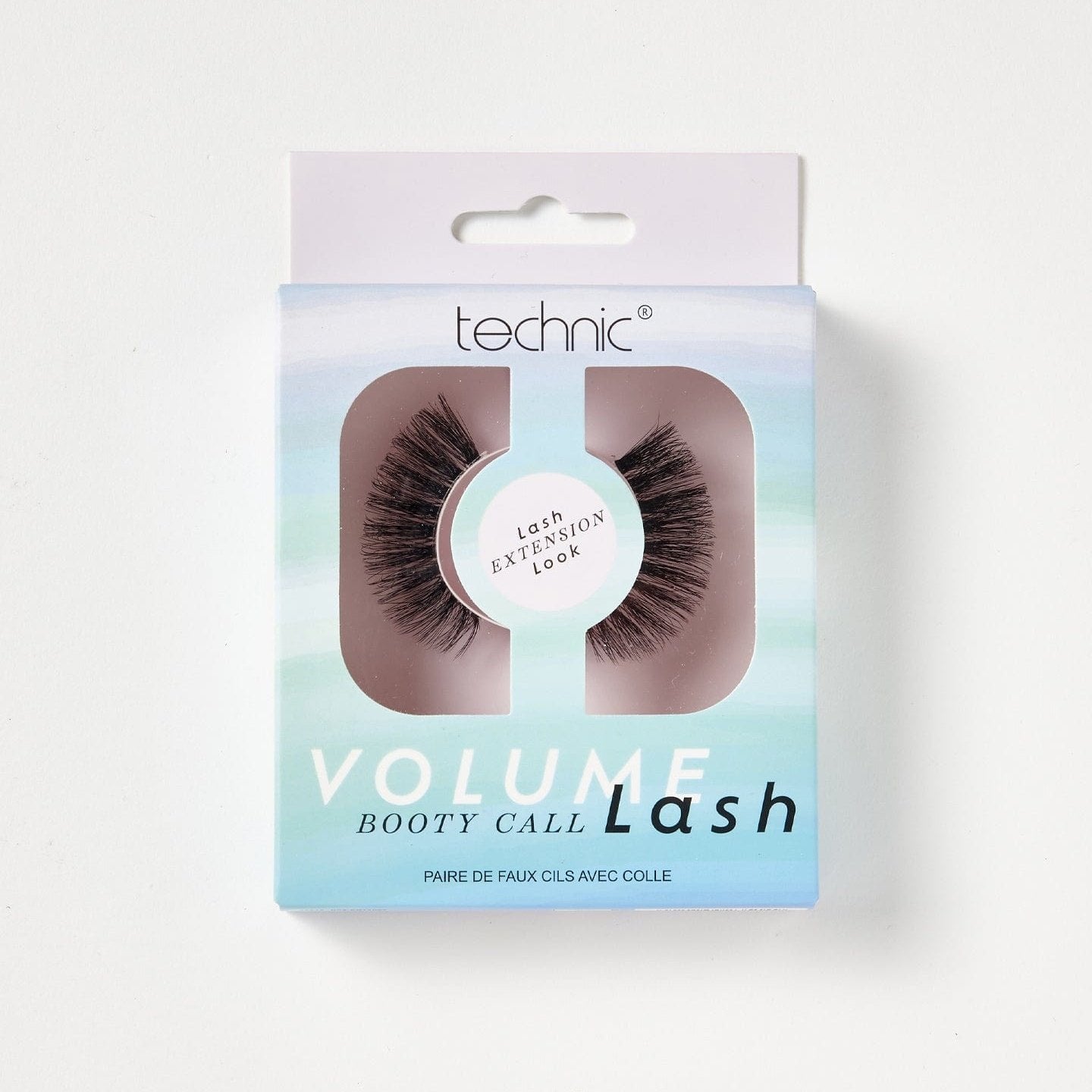 Volume lashes in the style Booty Call in a purple and blue pattered box on a white background.